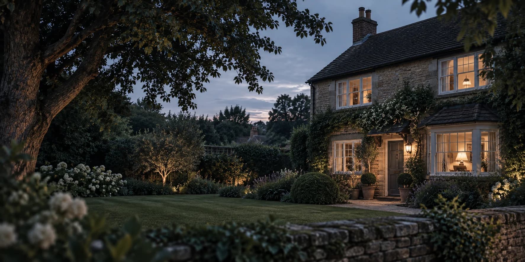 An established family home and garden at dusk